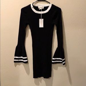 Black fitted “NO COMMENT” dress